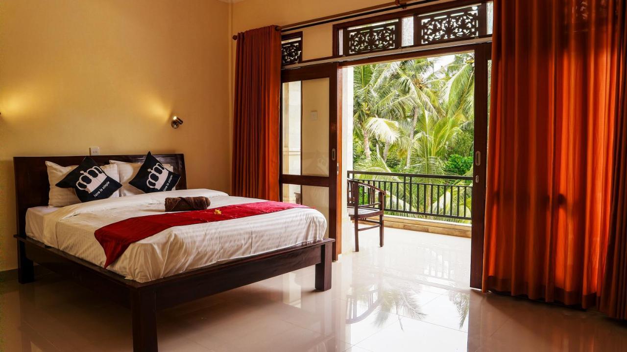 Bali 85 Beach Inn Падангбай Екстериор снимка