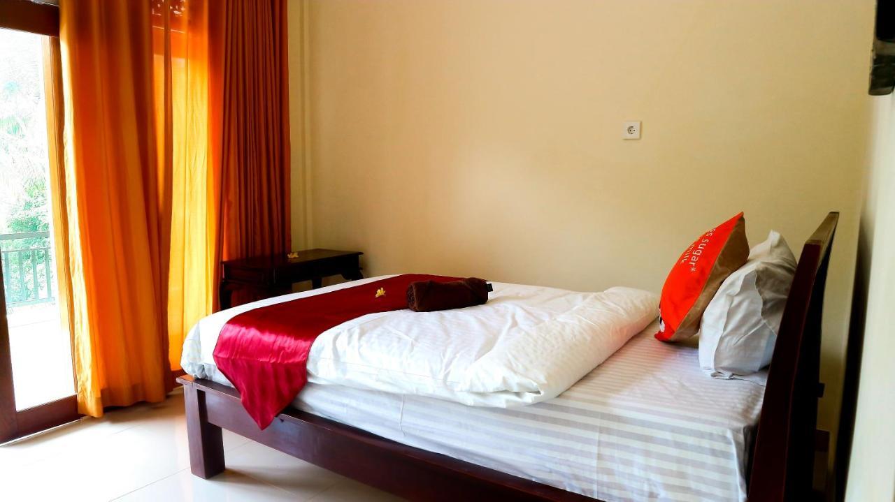 Bali 85 Beach Inn Падангбай Екстериор снимка